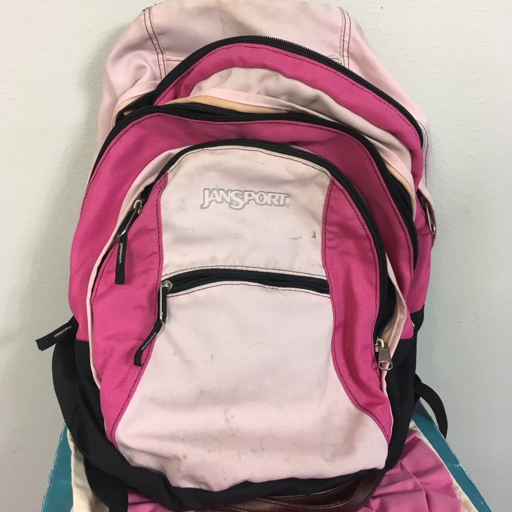 Pink multi pocket Jansport backpack